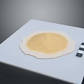 Light Yellow Powder Sample on White Square Platform With Black and White Striped Calibration Tool