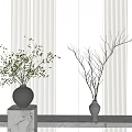Two Vases With Green Branches And Bare Twigs On Marble Pedestal Against Striped Wall