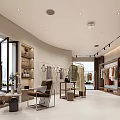 Bright Modern Light Luxury Clothing Store Interior With Elegant Garment Display And Marble Reception Counter