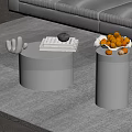 Modern Glass Top Coffee Table With Metallic Base Stack Of Books And Fruit Bowl
