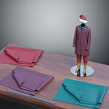 Mannequin Wearing Purple Coat Red Pants Brown Boots Red Christmas Hat With Fabrics On Table