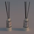 Two Scented Reed Diffusers with Black Sticks Transparent Bottles White Bases