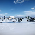 Two White and Black Motorcycles Parked on White Ground Under Blue Sky With White Clouds