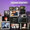 Alexander McQueen Exhibition With Stacked TVs Showing People Images And Visitors Taking
