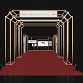Golden Archway Structure Featuring Red Carpet Passageway And Display Boards With Branded Sign