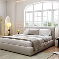 Double Bed In White Room With Arched Window Green Plants Wooden Floor And Rug