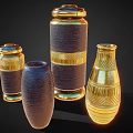 Decorative Ceramic Vessels With Gold Accents Textured Surfaces Lidded Tops And Various Shapes