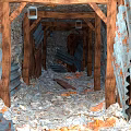 Abandoned Road Tunnel Featuring Wooden Support Frames Gravel Ground And Metal Walls