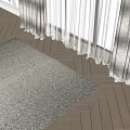Textured Light Colored Square Rug on Herringbone Wooden Floor with Sheer Curtains and Natural Light