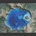 Natural Scenic View Of Blue Volcanic Crater Lake With Green Surroundings And Small Island