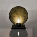 Decorative Ornament Combination with Lit Candle and Golden Circular Moon Texture on Black Square Base