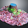 Green Plants Growing On Tree Stump Surrounded By Red Purple Fallen Leaves