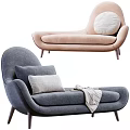 Modern Upholstered Chaise Lounge With Gray And Beige Fabric Pillows And Throw Blanket