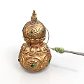 Golden Gourd Shaped Sculpture Featuring Intricate Patterns Green Gemstones And Decorative Details