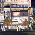 Vibrant Night Commercial Street With Street Lamps Neon Lights Outdoor Seating And Shop Signs