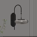 Modern Sleek Wall Lamp With Metal Bracket And Textured Shade On Beige Wall Beside Green Plant