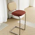 Modern Upholstered Bar Stool With Beige Red Seat And Metal Frame In Interior Space