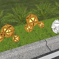 Geometric Shaped Gold and Silver Outdoor Lights Illuminated on Green Lawn with Plants