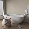 Stylish Bathtub In Bathroom With Wicker Basket Towel Hanging Bathrobe And Slippers