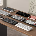 Multiple Computer Keyboards In Various Colors And Styles On Wooden Desk 3d model