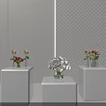 Hanging Basket Plants Decor With White Pedestals Vases Flowers And Diamond Pattern Wall Backdrop