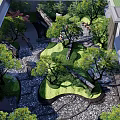 Landscaped Courtyard Garden with Large Rocks Flowing Water Feature Green Trees and Trimmed Shrubs