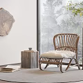 Wicker Lounge Chair With White Cushion Near Large Window Trees Outside Wooden Table And Rug