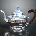 Elegant Silver Teapot With Exquisite Carved Design Wooden Handle And Shiny Finish
