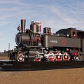 Vintage Black Steam Train With Red Wheels On Outdoor Display Platform