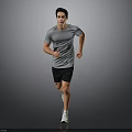 Active Male Runner In Gray T Shirt Black Shorts And White Sneakers