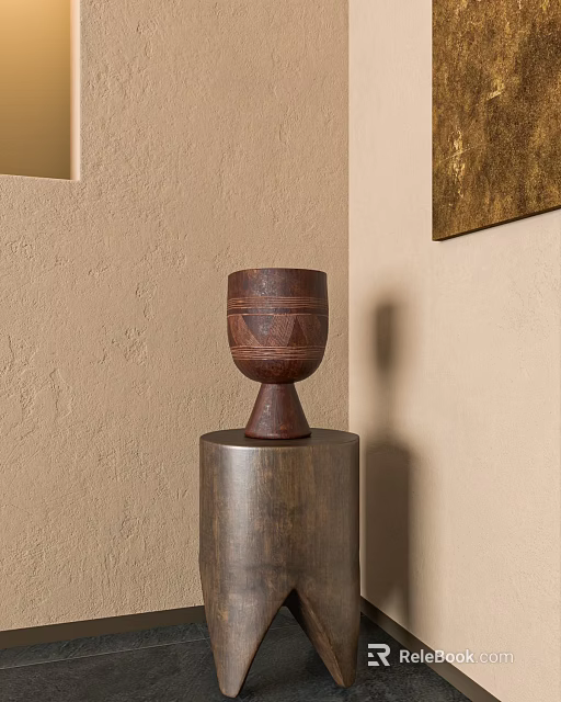 Brown Decorative Vase On Metal Cylinder Base Against Beige Textured Wall With Gold Framed Artwork 3d model 