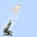 Military Weapon Missile With Blue White Stripes Launched From Camouflage Launcher Emitting Flames