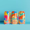 Colorful Canned Drinks with Vibrant Geometric Patterns and Refreshing Design on Blue Background