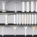 Modern White Perforated Columns With Varied Shapes Displayed on Shelves