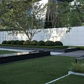 Modern Entrance Gate With Metal Panels Geometric Logo And Shadow Patterns