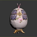 Rabbit Themed Decorative Egg Featuring Pink Ears Blue White Pattern And Golden Base 3d model