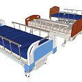 Medical Hospital Beds With Blue Mattresses Red Headboards Metal Rails And Movable Wheels
