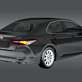 Black Toyota Camry Sedan Featuring Sleek Exterior Design And Modern Headlights
