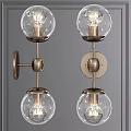 Modern Vintage Brass Wall Sconces With Clear Glass Globes On Gray Wall