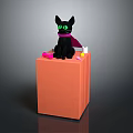 Black Cat With Green Eyes Purple Cape Sitting On Orange Cube With Pink Yellow Objects