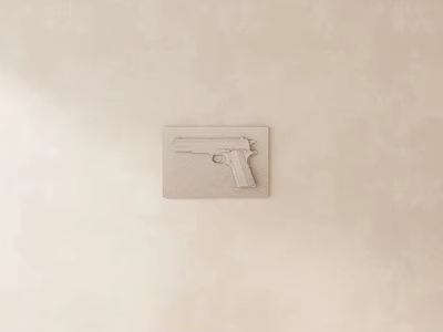 Pistol Shaped Carving On Light Colored Wall 3d model