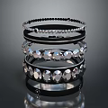 Elegant Black Bracelets Stacked With Sparkling Crystal Accents And Metal Bands
