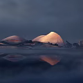 Modern Cultural Center Building With Curved Roof Structures Illuminated At Dusk With Water Reflection