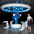Woman Observing Interactive Tech Display Stand With Blue Spheres Connecting Lines And Digital Screens
