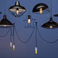 Modern Black Pendant Lights With Various Designs Star Shaped Shades And Lit Bulbs