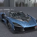 McLaren Blue Sports Car With Aerodynamic Rear Wing And Sporty Exterior Design