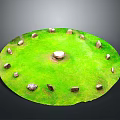 Circular Stone Circle Structure With Central Large Stone And Surrounding Small Stones On Green Lawn