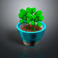 Green Potted Plant With Fresh Leaves In Blue Flower Patterned Pot With Orange Stripes