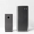 Modern Black Speakers With Minimalist Design Two Sizes Tall And Short Textured Surface White Background
