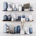 Stylish Modern Bathroom Accessories Display On Wooden Shelf Featuring Blue White Bottles Candles And Containers
